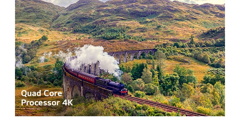 Voz koji ispušta paru na šinama nalazi se u sred planine sa tekstom „Četvorojezgarni procesor 4K” u donjem levom uglu.