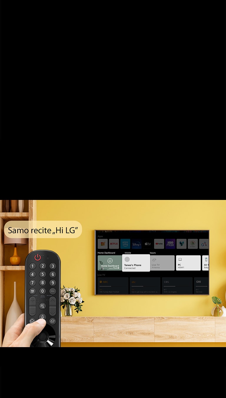 Neko drži daljinski upravljač televizora ispred TV ekrana. U balončiću za govor stoji „Just say Hi LG”.
