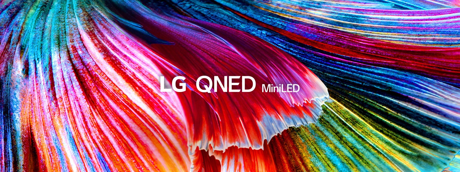 Prikaz izbliza sa talasima materijala svetlih nijansi crvene, plave, zelene i žute boje.