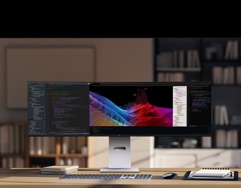 Kućna kancelarija s širokim LG monitorom na kom su kontrolne table s podacima i grafikoni, s bežičnom tastaturom i mišem.