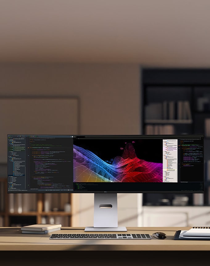 Kućna kancelarija s širokim LG monitorom na kom su kontrolne table s podacima i grafikoni, s bežičnom tastaturom i mišem.