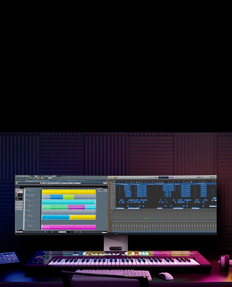 Prostor za muzičku produkciju s LG UltraWide monitorom na kom su prikazani slojevi zvučnih zapisa i vremenska osa projekta.