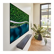 LG 65'' (165 cm) 4K HDR Smart OLED TV, Slight tilted at an angle, a living room with a TV showing an aerial view of nature, OLED65WX9LA, thumbnail 10