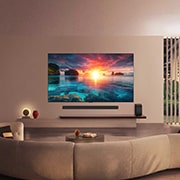 LG 55-inčni LG OLED evo AI G6 4K pametni TV 2026, LG OLED evo AI G6 prikazuje živopisnu scenu zalaska sunca nad okeanom, sa soundbar uređajem i zvučnikom postavljenim ispod ekrana, što doprinosi spokoju i ambijentu životnog prostora., OLED55G61LW, thumbnail 15