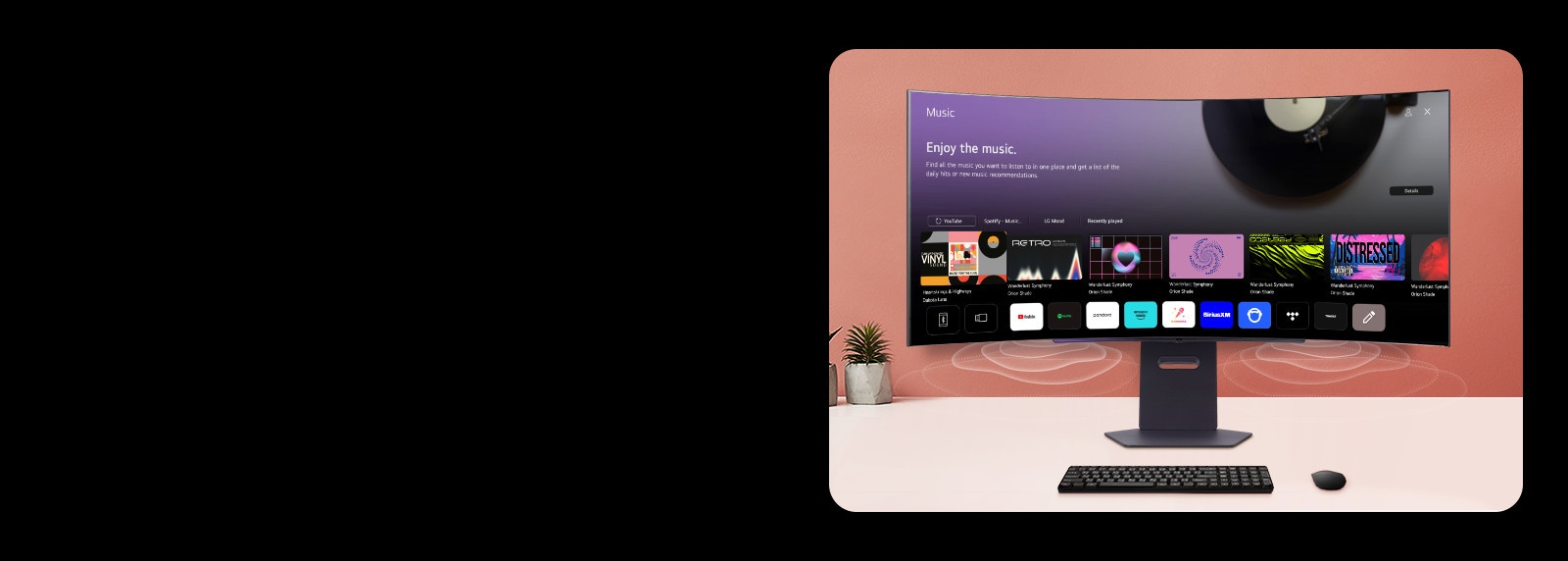 На экране смарт-монитора, размещенного на столе, изображен экран MUSIC APP.