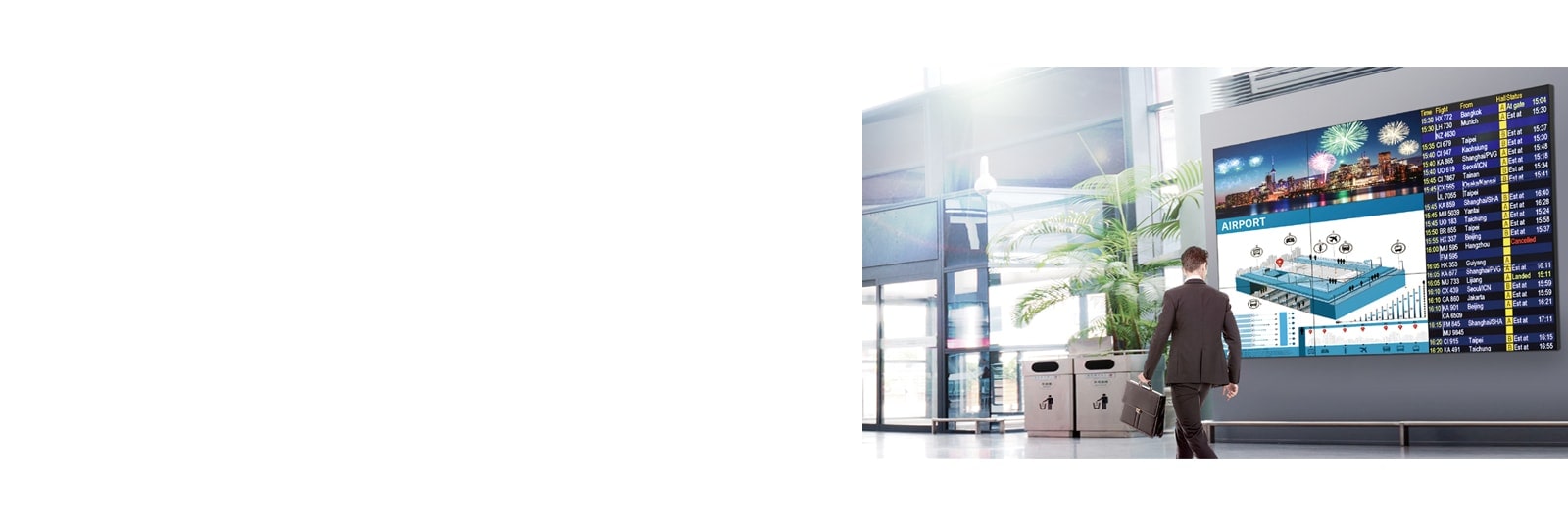 Мужчина проходит мимо, глядя на экран, и экран отображает яркие цвета под любым углом.