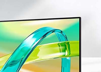 Монитор LG FHD отображает зелено-желтый градиентный фон с полупрозрачным изогнутым объектом, парящим на экране.