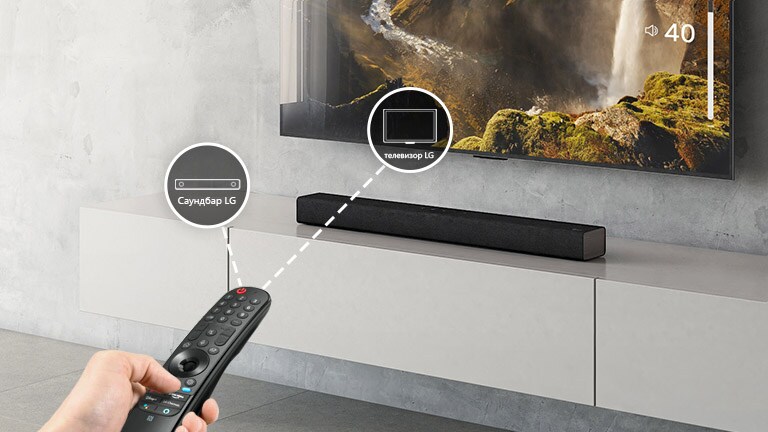 There is a LG remote control in someone's hand, controlling TV and sound bar at the same time. There are icons of LG TV and LG Sound bar. 