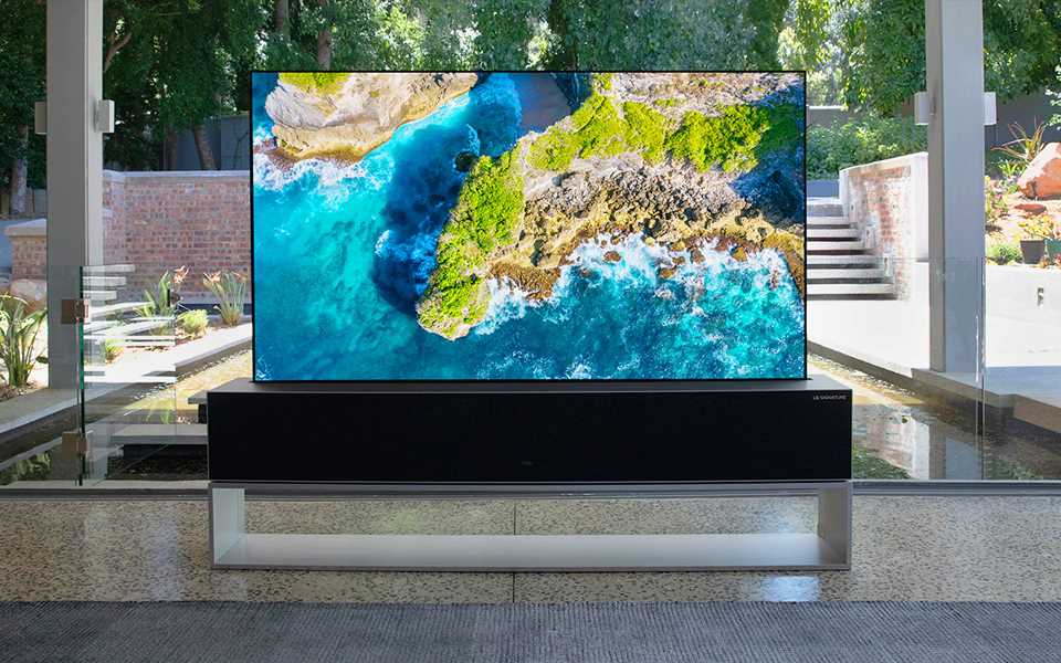 LG SIGNATURE OLED TV R showing crystal clear blue waters and a rugged coastline | More at LG MAGAZINE