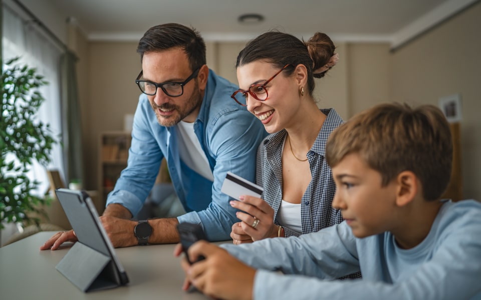 A family looking at a tablet