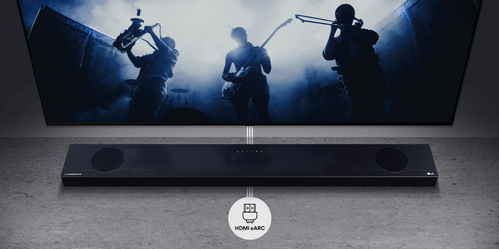 TV is on the wall. TV shows a group of band in black silhouette. LG Soundbar is right below TV on a gray shelf. There is a HDMI eARC icon below the soundbar.