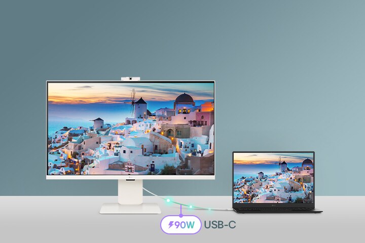 Fotografia zobrazujúca inteligentný monitor pripojený k notebooku cez USB-C, ktorý slúži na nabíjanie a prenos dát.