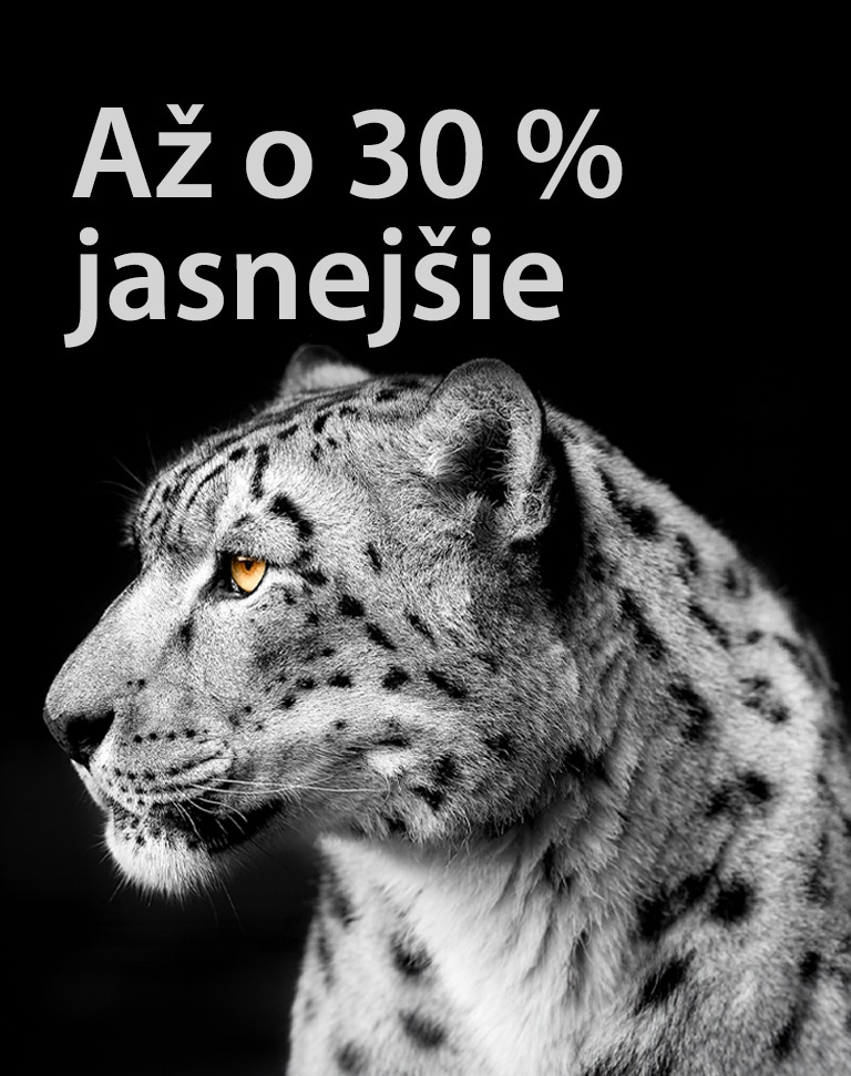Biely leopard ukazuje zboku svoju tvár na ľavej strane obrázka. Na ľavej strane sa zobrazuje nápis „Až o 30 % jasnejšie“.