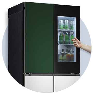 The front view of a black InstaView refrigerator with the light on inside. Hands tapping on InstaView screen.