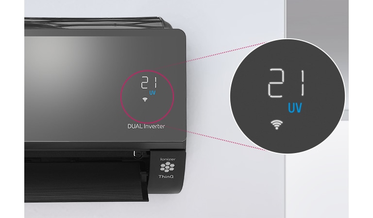 Можна побачити половину кондиціонера LG, встановленого на стіні з відкритими передніми жалюзями, що вказує на те, що він увімкнений. Зображене коло навколо індикаторів температури повітря та збільшене коло праоруч, в якому показані індикатори температури повітря. Логотип DUAL Inverter можна побачити на корпусі кондиціонера.