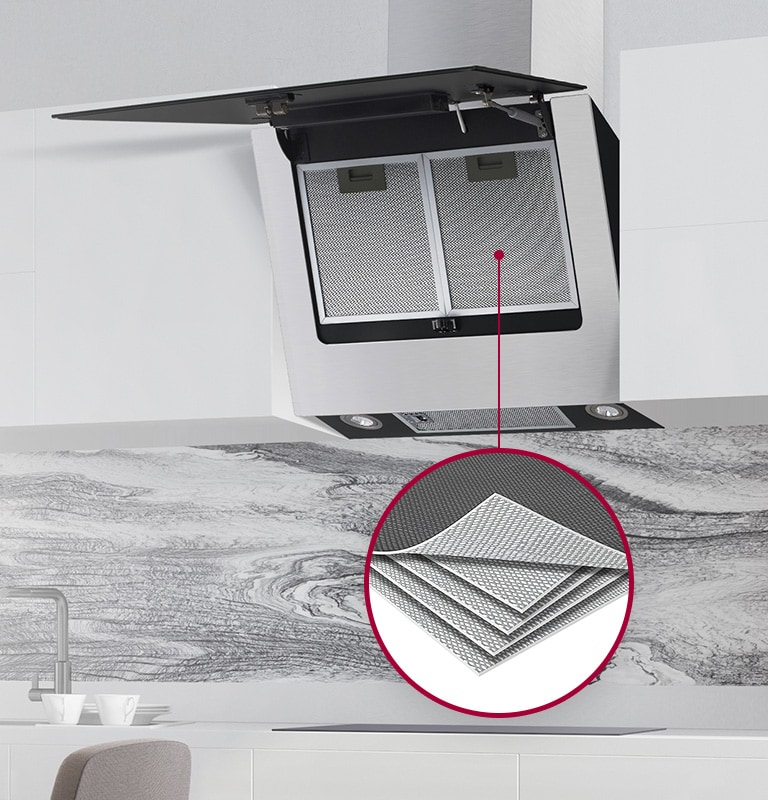 The hood is shown installed in a kitchen, the front door is open revealing the five-layer aluminum mesh inside. A circle with a line shows a magnified image of the five layer mesh inside the hood.