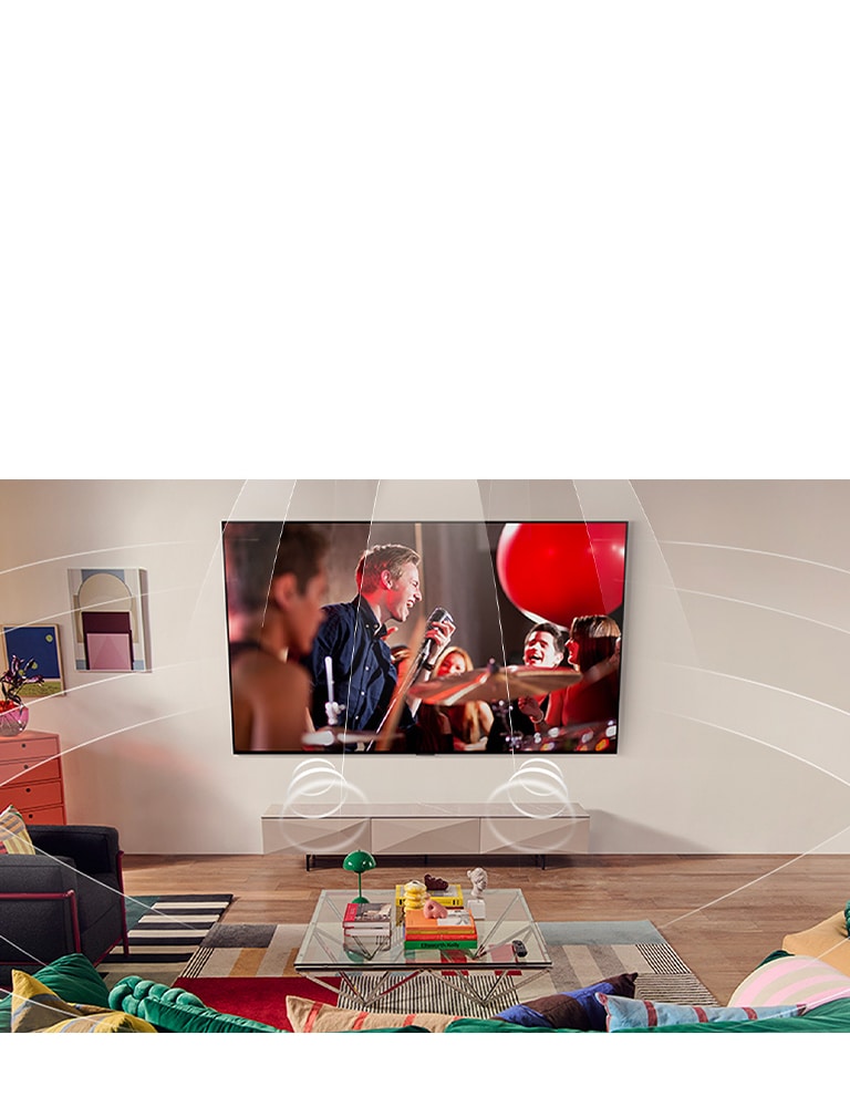 Вітальня з телевізором LG, закріпленим на стіні. Звукові хвилі графічно заповнюють простір, демонструючи, як віртуальні 9.1.2-канали створюють ефект об’ємного звучання для користувача