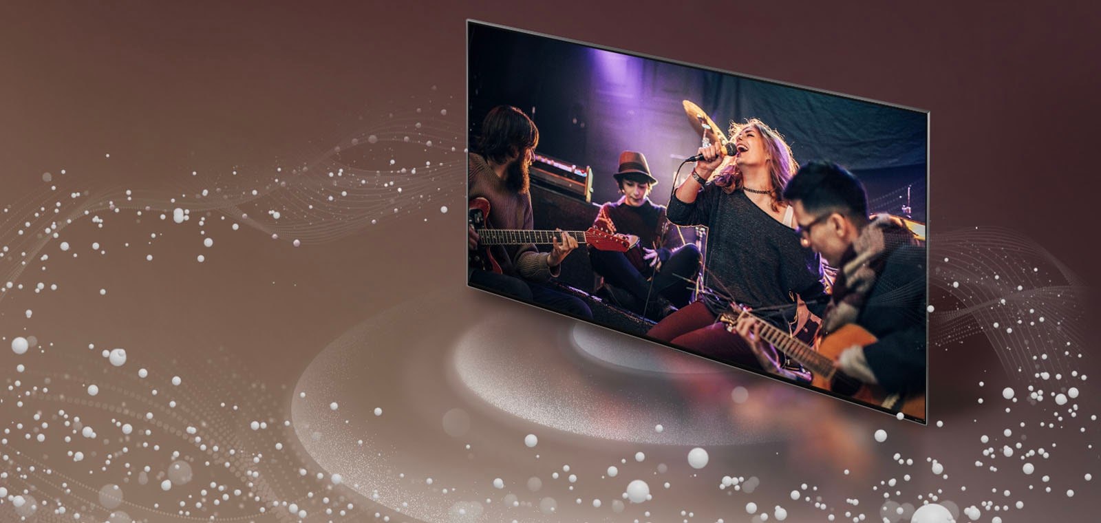 Телевізор LG випромінює з екрана звукові бульбашки й хвилі, що заповнюють приміщення.