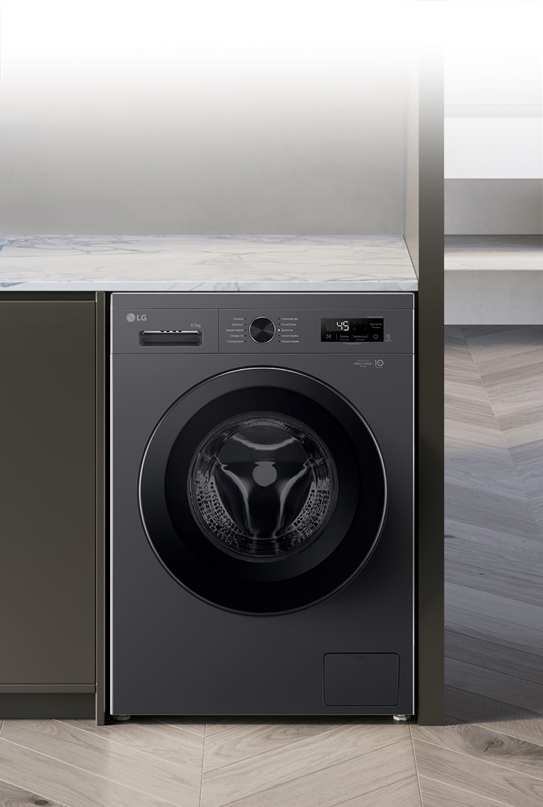 Зображено пральну машину посеред інтер'єру