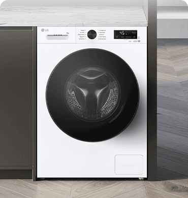 Зображено пральну машину посеред інтер'єру