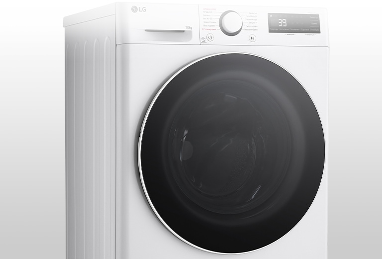 Це збільшене зображення металевої ручки на панелі пральної машини.