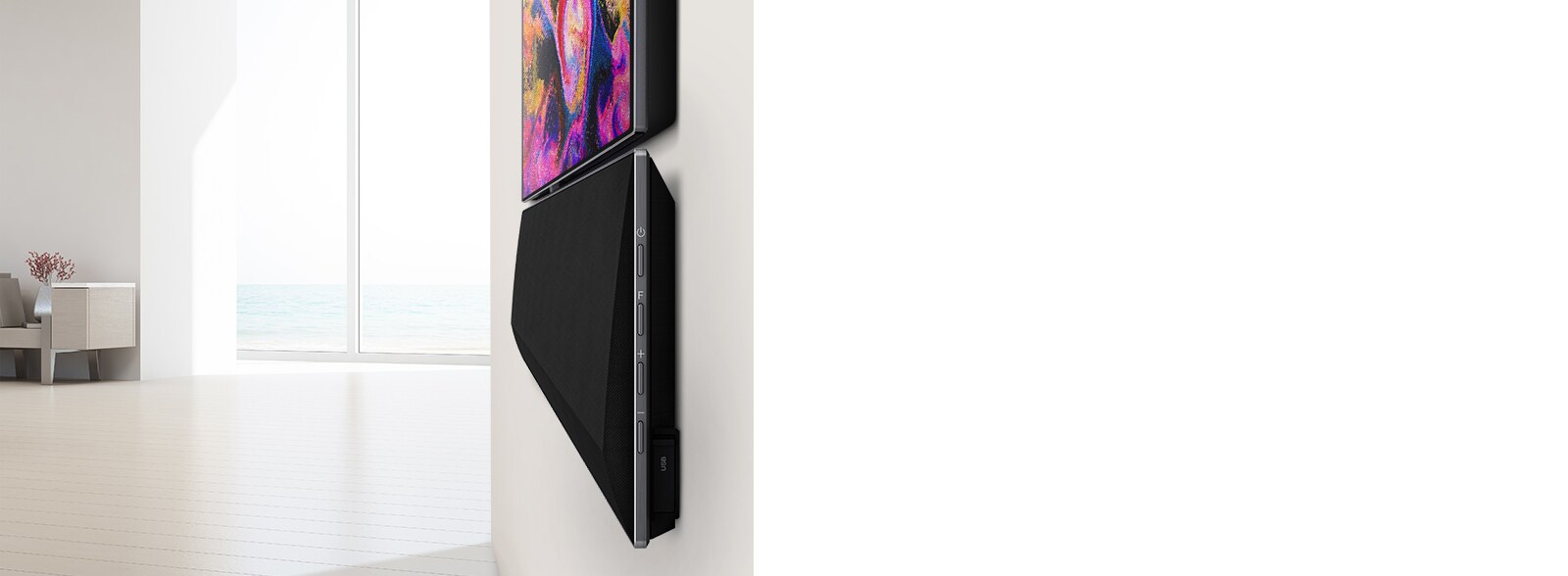 Великий план настінного телевізора і саундбара LG. На екрані телевізора відображаються різні рожеві кольори.