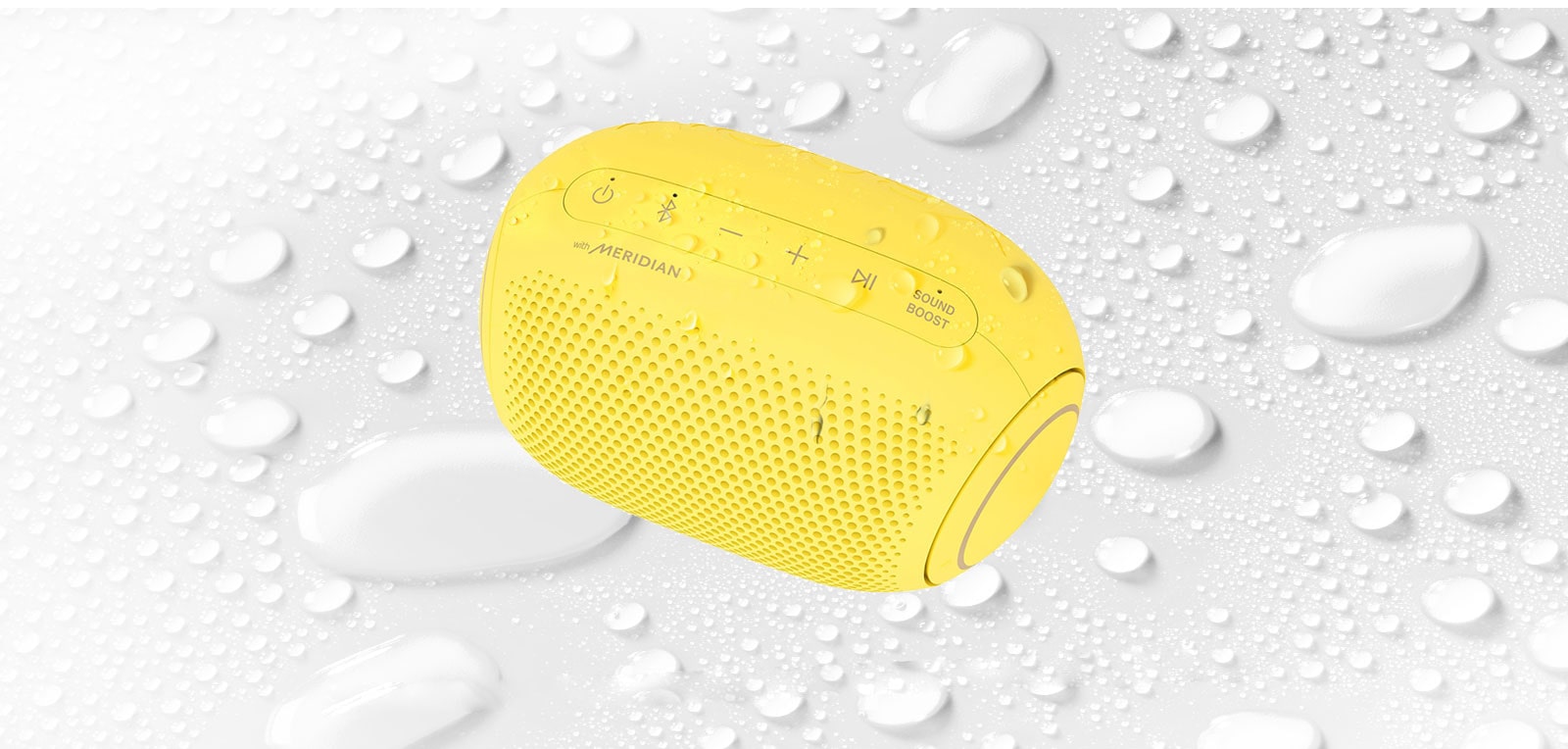 On a white background, LG XBOOM Go is facing up to the left. There are water droplets on and underneath LG XBOOM Go.