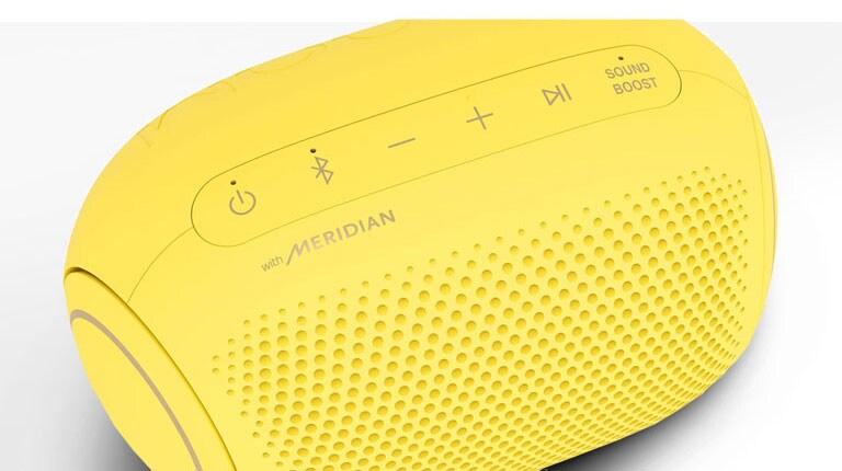 On a white background, There is a close-up of LG XBOOM Go's Meridian logo with magenta lighting. 