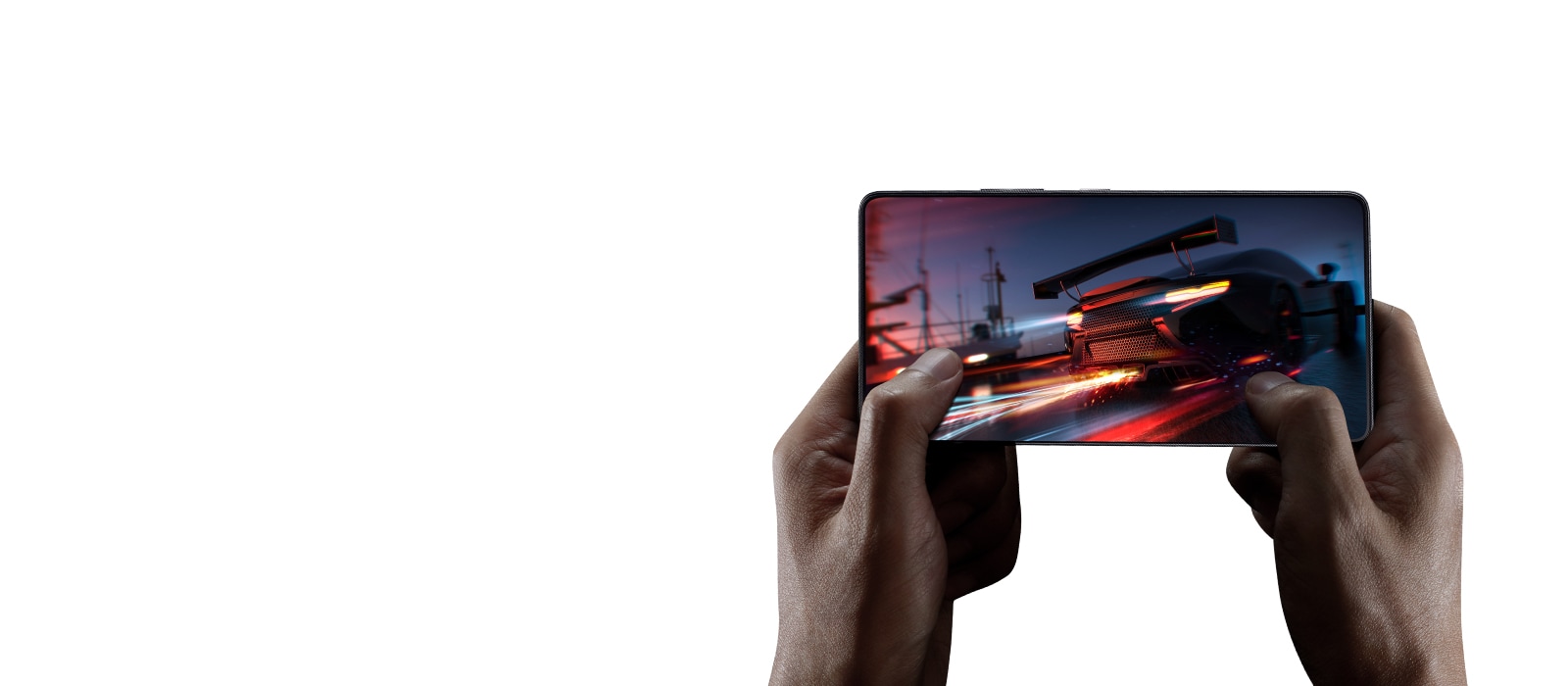 Зближене зображення рук під час гри в перегони на мобільному телефоні.