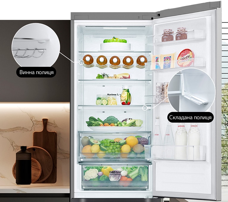  В холодильнику, який наповнений свіжими продуктами, відкриті дверцята, та демонструється наявність винної та складаної полиць.