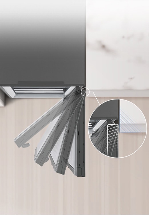 Вид згори донизу на холодильник, встановлений біля стіни з нульовим зазором дверної петлі.