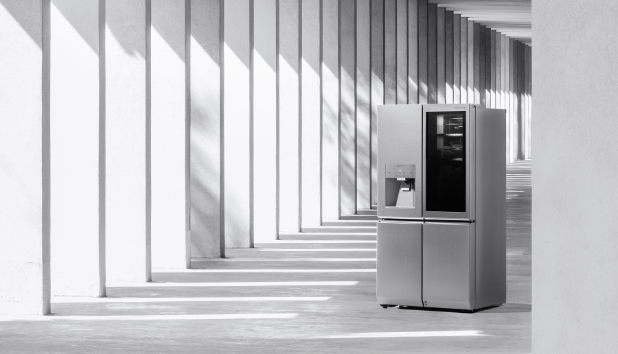 lg signature refrigerator and columns in a row in a wide aisle with sunlight and shadow