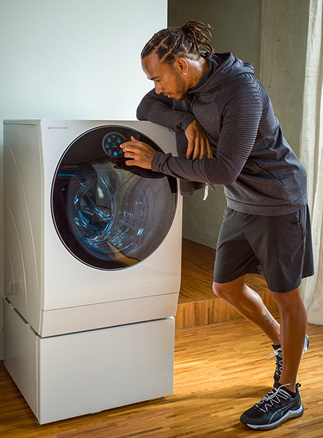 Lewis Hamilton touching LG SIGNATURE Washing Machine's Quick Circle display.