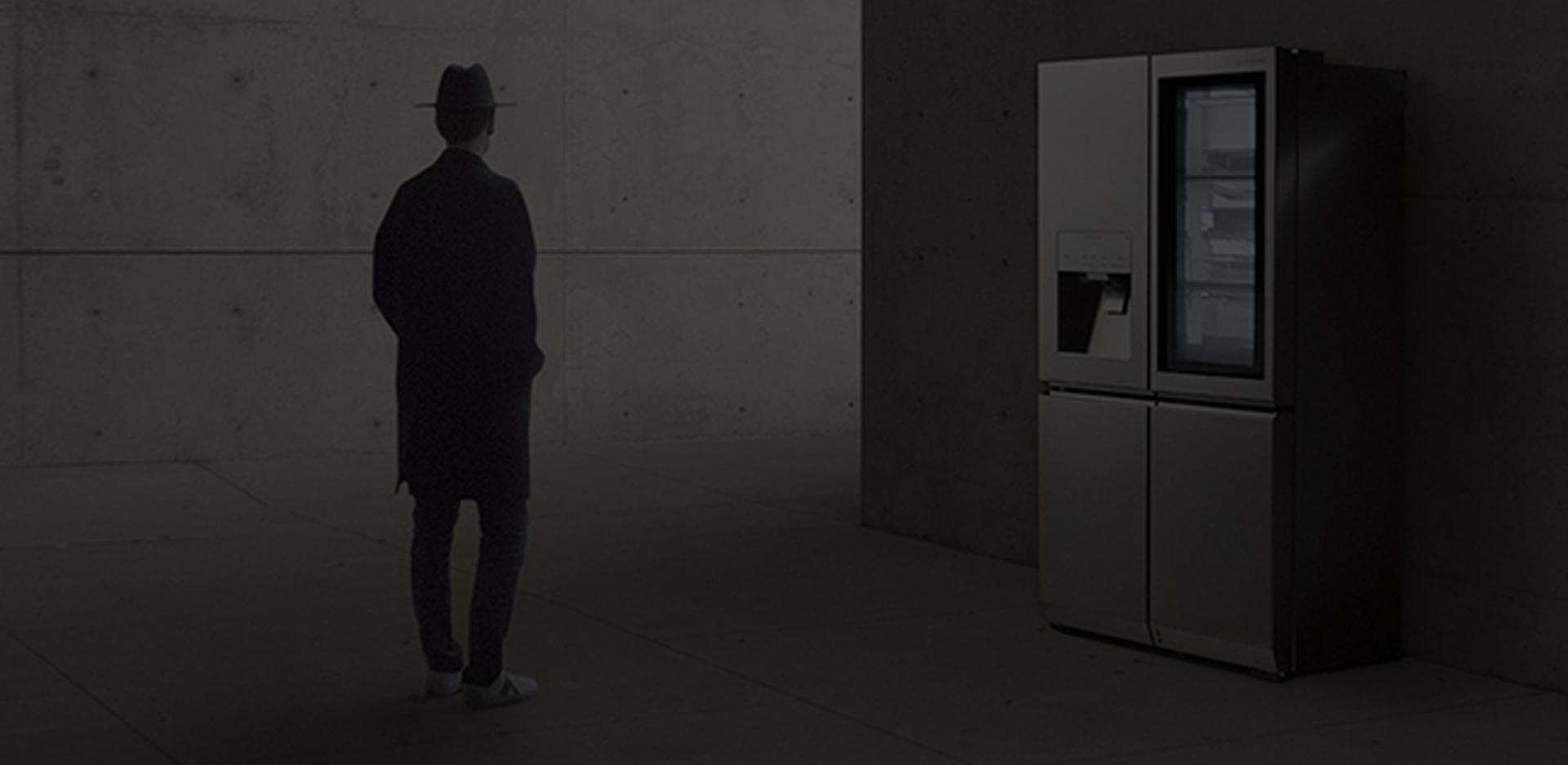 creator and photographer of minh tran is standing in front of lg signature refrigerator and staring it in the overall unique architectural site