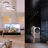 LG SIGNATURE OLED in front of large windows with a view of the city. LG SIGNATURE TWINWash in a dark-themed room in front of large windows with a view of the city.