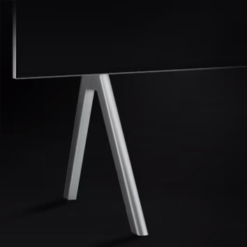 Close-up of LG SIGNATURE M 97 Inch Smart TV 2023, from the front focusing on the stand.