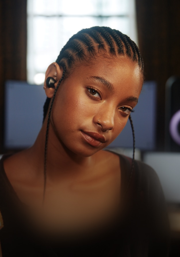 Willow Smith wearing LG Wireless Earbuds
