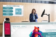 Greet, guide, and inform visitors with CLOi GuideBot and bold lobby signage