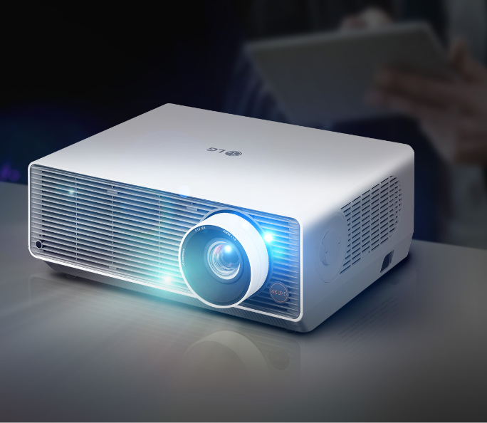 A close-up of an LG Projector on a desk