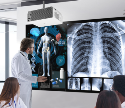 Doctors reviewing medical imagery on projector screen