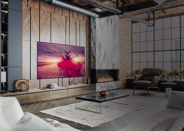 man standing in front of beachfront living roof with lg tv on wall