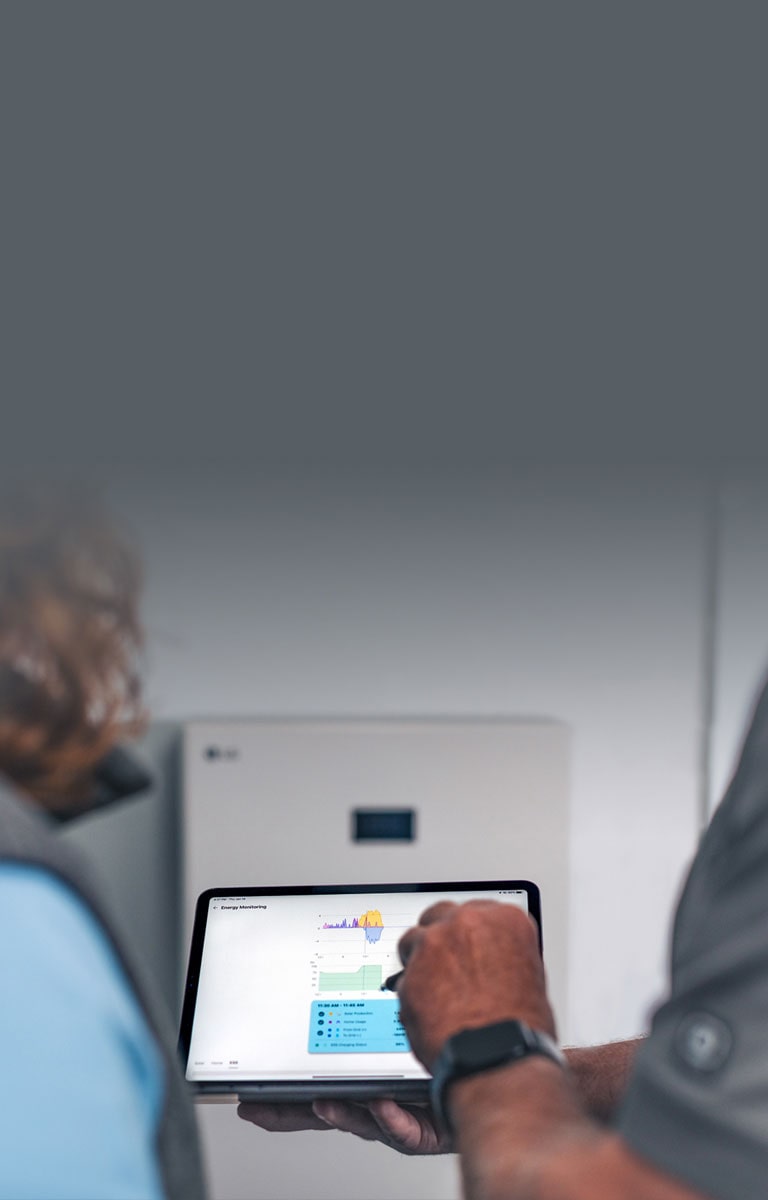 Technician showing a customer energy savings on his tablet