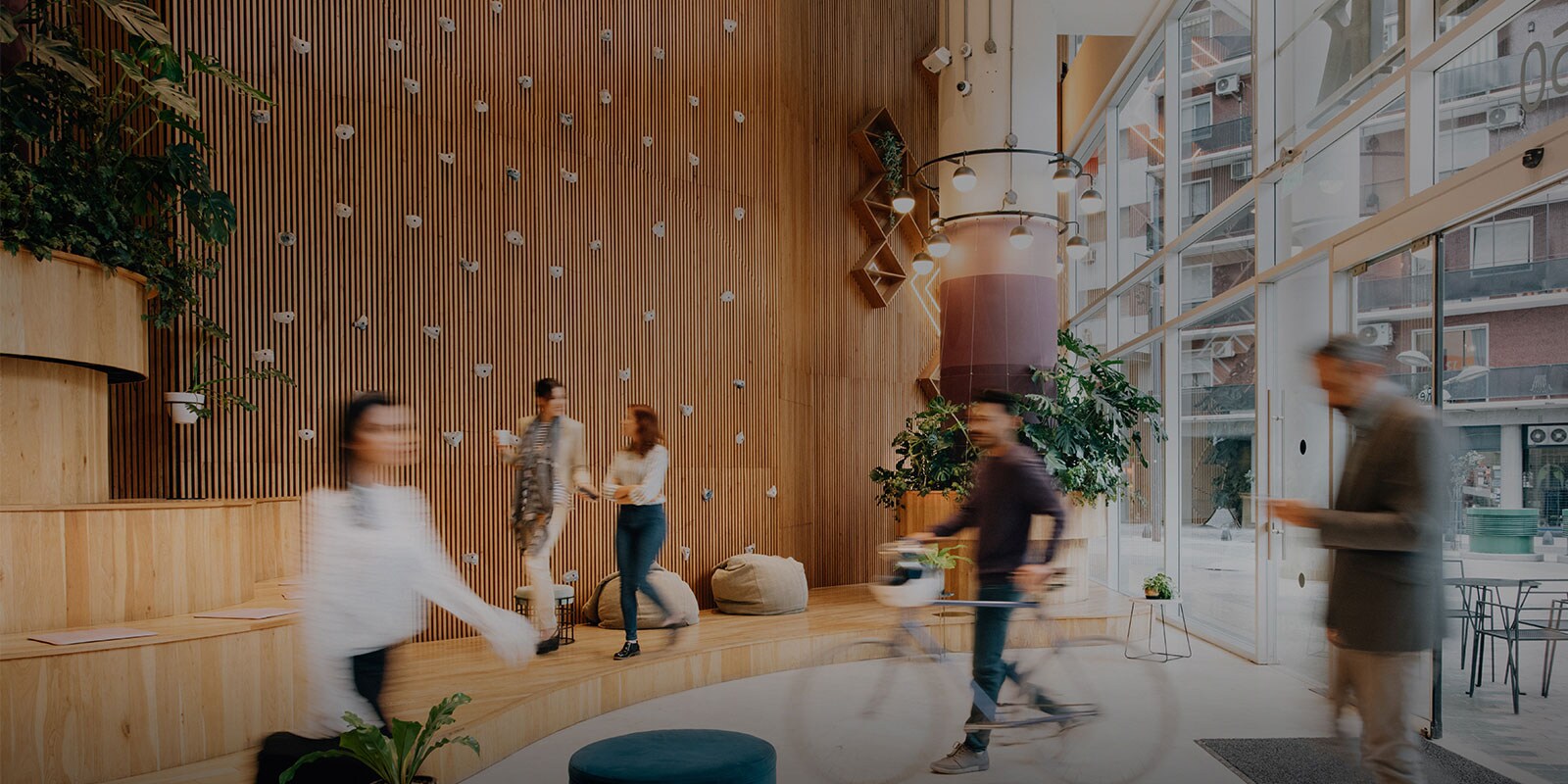 people walking through a office lobby