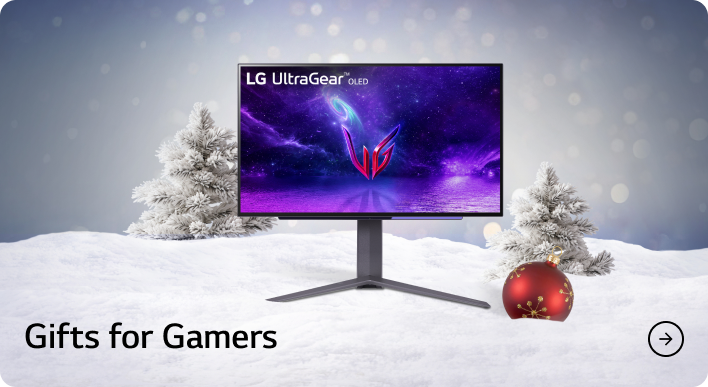 An LG UltraGear OLED monitor in a festive snow bank