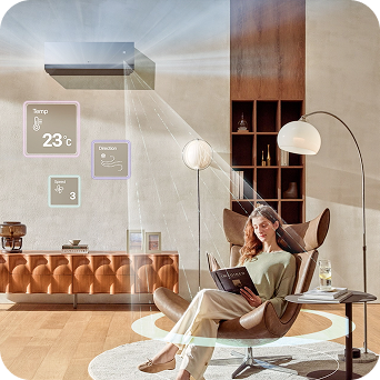 Woman relaxing in a smart living room while the LG DUALCOOL AI air conditioner automatically adjusts temperature, airflow, and humidity — its radar sensor detecting her position to deliver personalized indirect cooling.