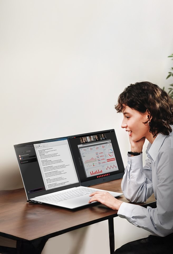 A woman uses her LG gram AI laptop with a dual-screen setup for video conferencing and multitasking in her home office. Hybrid AI seamlessly switches between gram chat On-Device for offline tasks and gram chat Cloud for online research.