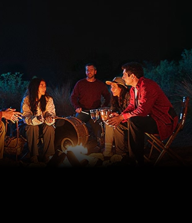 People enjoying camping with smiles, embracing the power of optimism.