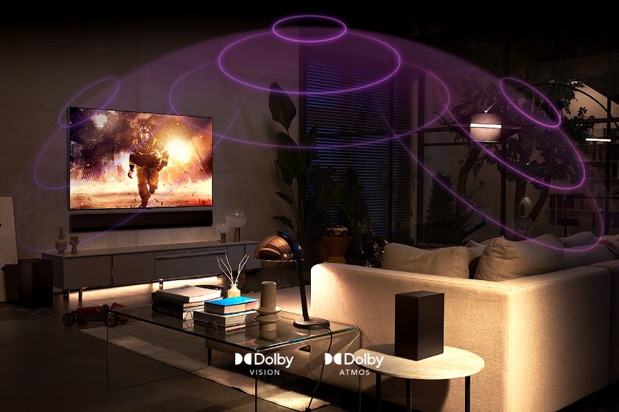 A movie plays on-screen with sound waves reverberating from the TV. Dolby Vision logo. Dolby Atmos logo.
