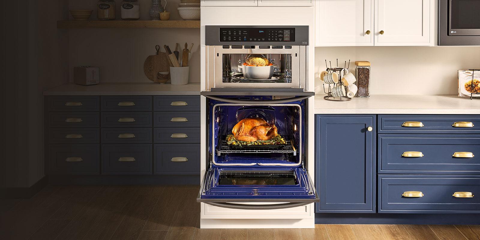 Lg Wall Ovens Discover Built In Usa An Lg Wall Oven With Open Doors Showing Prepared Food In A Luxury Kitchen