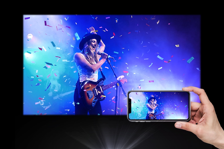A phone is shown playing a concert with the same content projected larger.